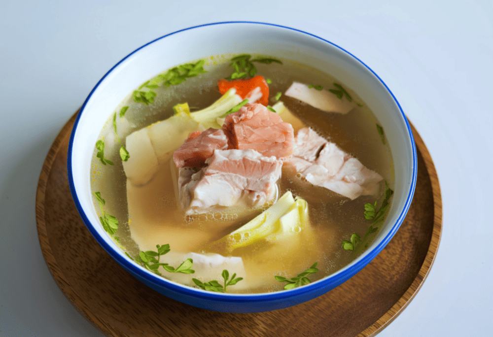 A traditional mountain delicacy featuring tender bamboo shoots paired with fresh stream fish (Source: Canva)